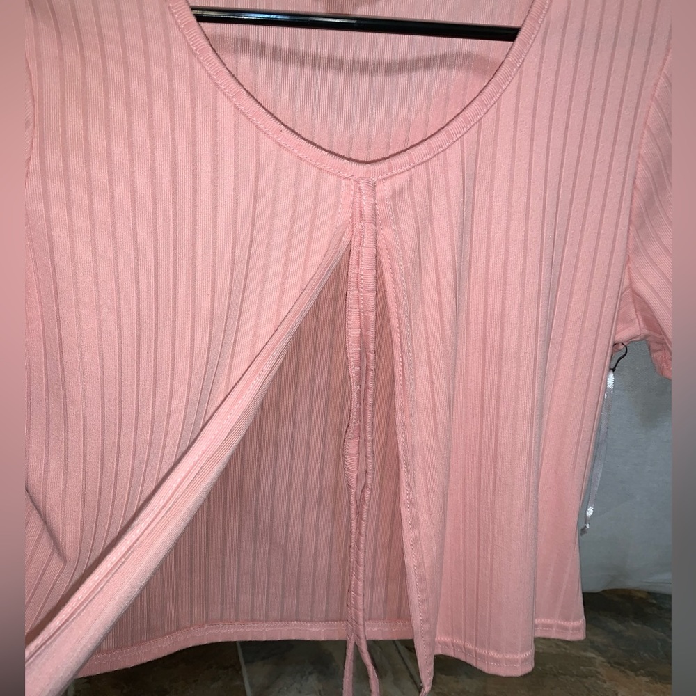Pink crop top that’s open in front